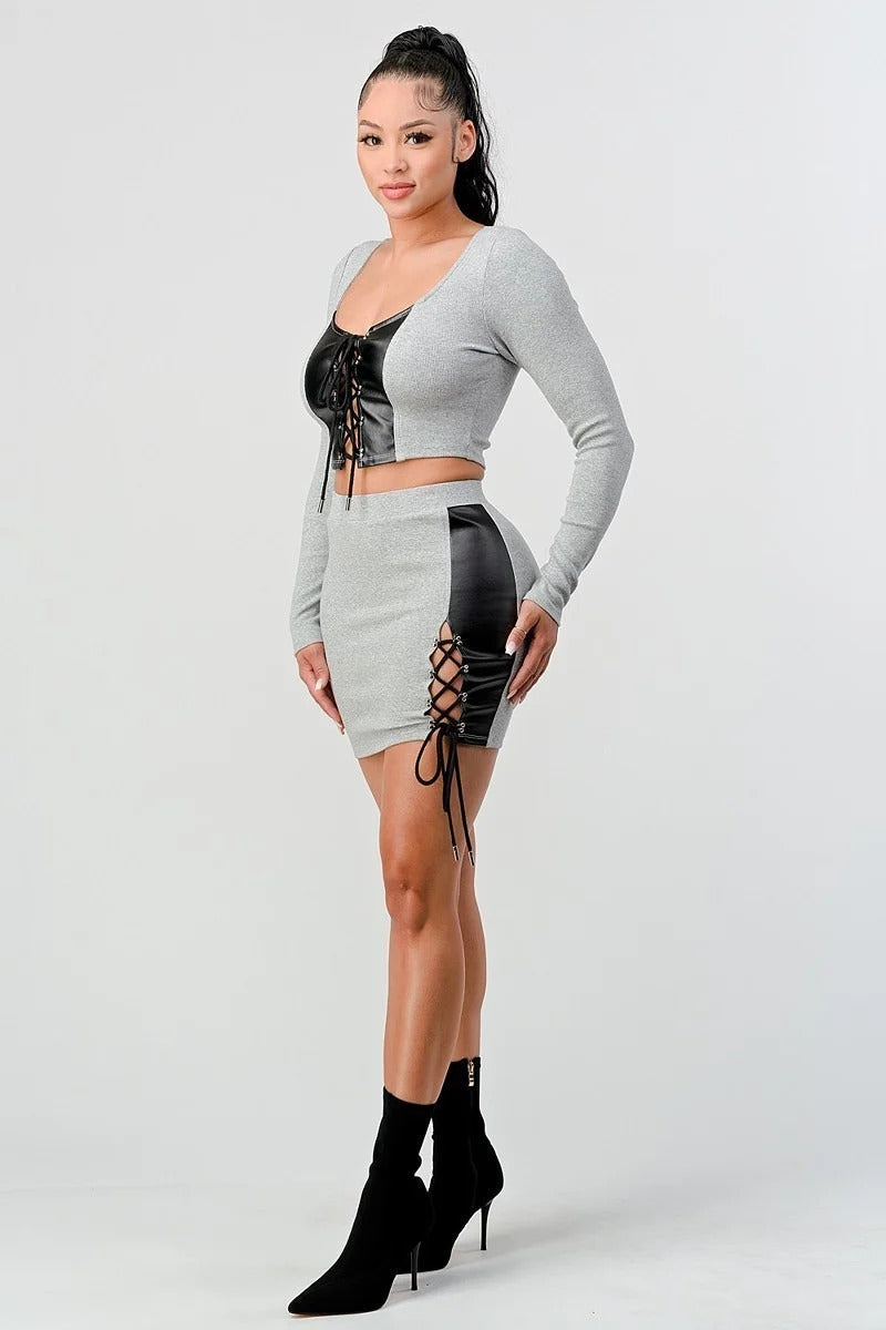 2 Piece grey and black Set Cropped Long Sleeve Shirt With Pu Leather lace up Detail on top and Matching Mini Skirt side view