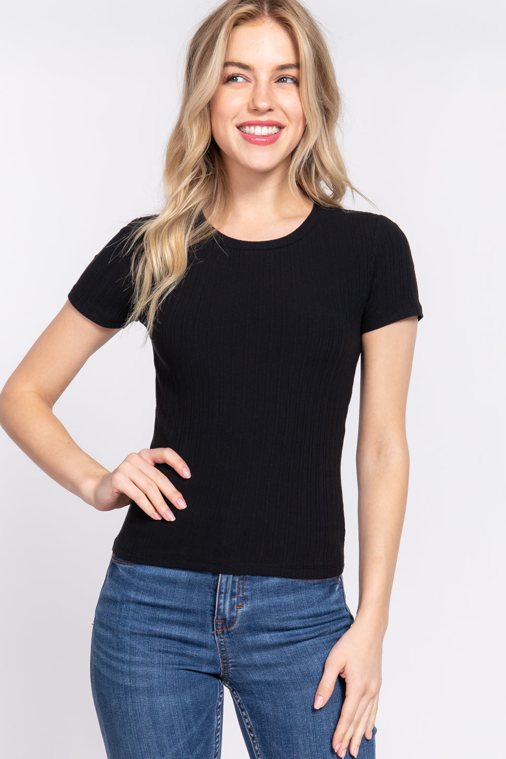 Women's black short sleeve top features a crew neckline and variegated rib knit fabric