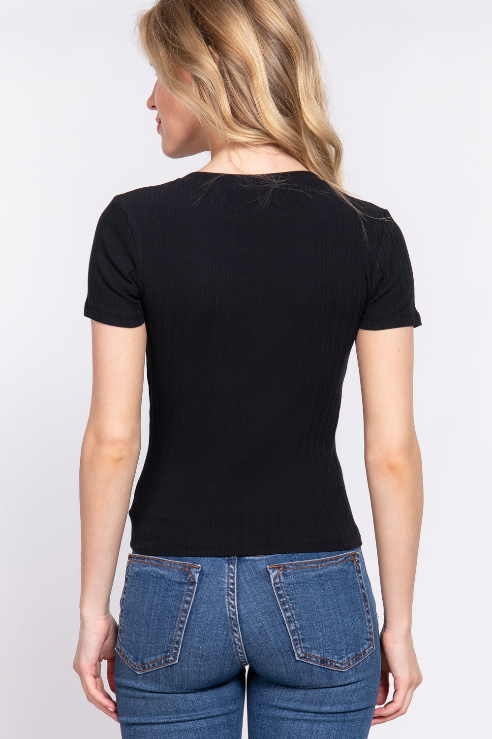 Women's black short sleeve top features a crew neckline and variegated rib knit fabric rear view