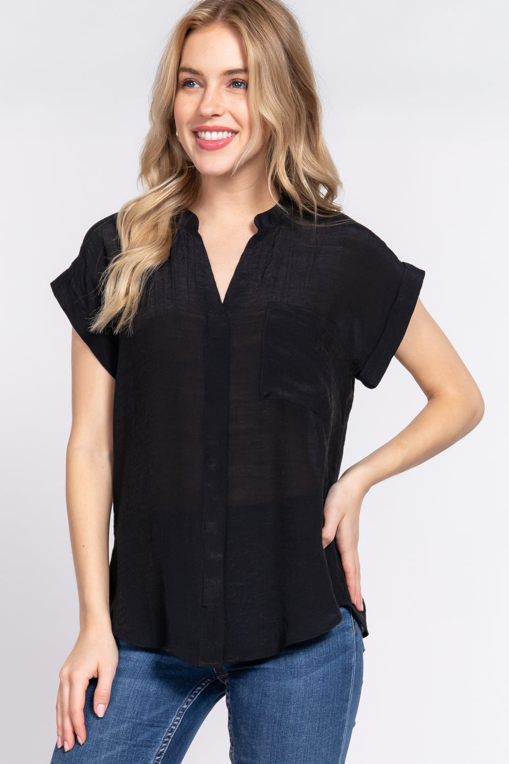 Women's black dolman sleeve woven top with open neck, front pocket, button down front and back slit.